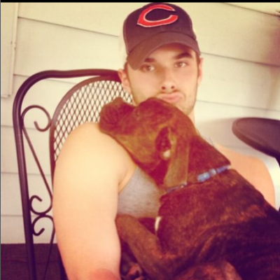 Picture of Josh Swickard and his dog Brindle.